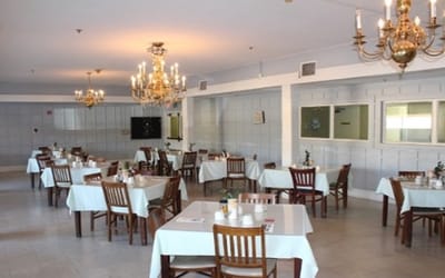 Dining area with tables and chandeliers