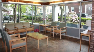 Bright common area with seating and outdoor view