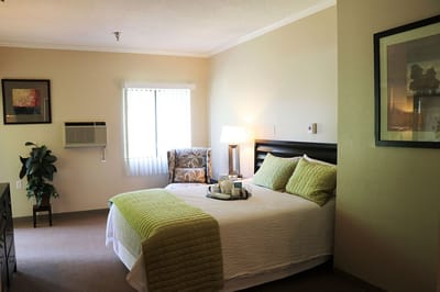 Cozy private resident room with bed and window