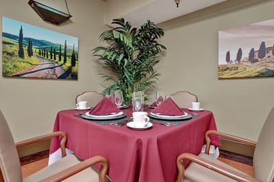 Well-decorated dining area with a table set for a meal