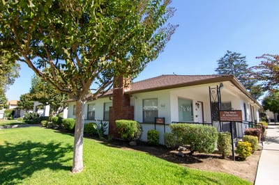 Exterior view of the assisted living facility with landscaping