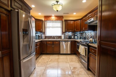 Spacious kitchen with wooden cabinets and modern appliances