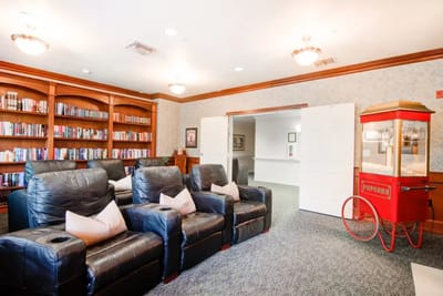 Cozy common area with a popcorn machine and bookshelves