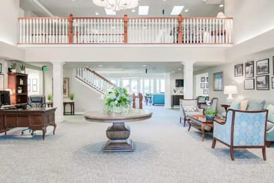 Bright lobby area with seating and flowers