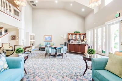 Bright and spacious lounge area with seating and bar.