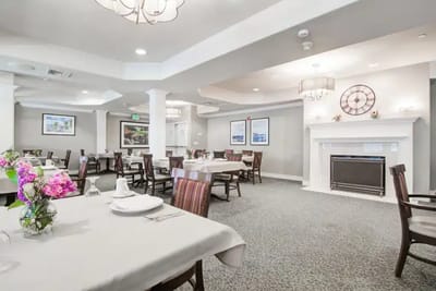 Dining room with tables set for meals and décor