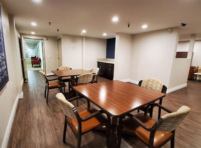 Bright interior of a common area with tables and chairs