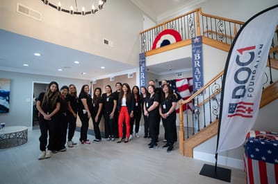 Staff members posing in the facility's lobby