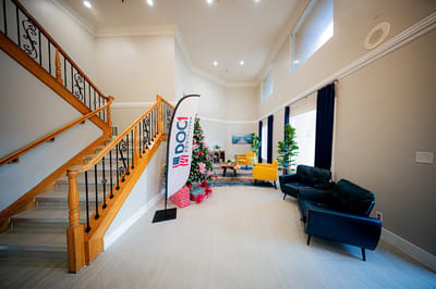 Bright lobby area with seating and decorative Christmas tree