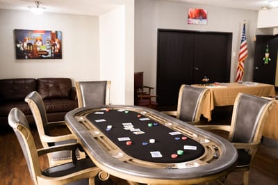 Activity room with poker table and seating