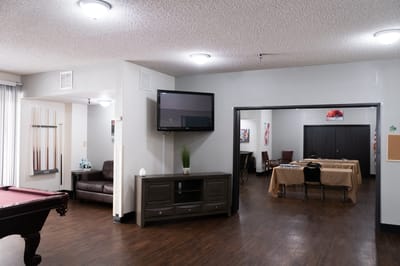 Common area with tables and seating in the facility
