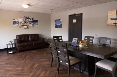 Interior common area with a dining table and couch