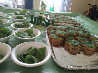 Display of festive green cookies and snacks