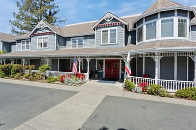 Building exterior of Aegis Assisted Living with gardens