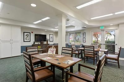 Interior view of a common area with tables and chairs