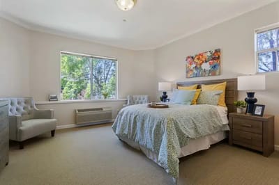 Cozy assisted living bedroom with bright lighting