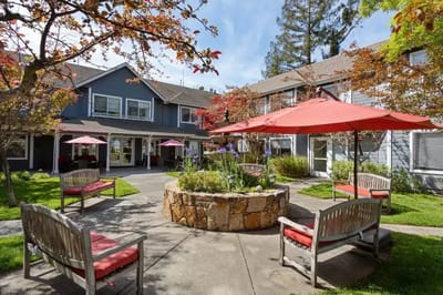 Outdoor courtyard with benches and umbrellas