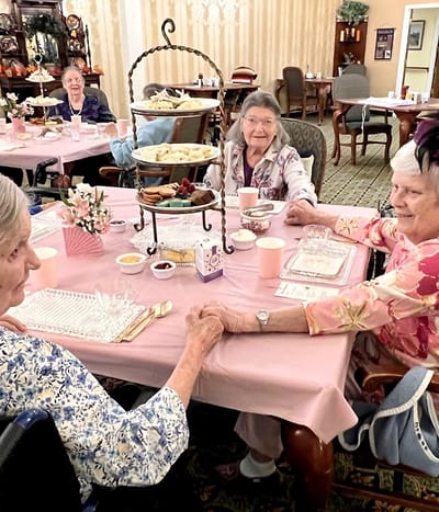 Residents enjoying a meal in a dining area