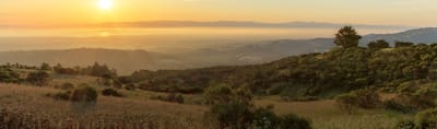 Scenic view of a sunset over rolling hills