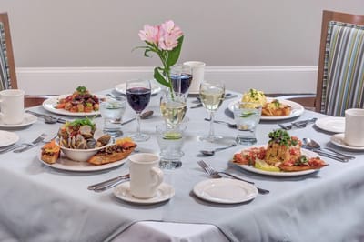 Elegant dining table set with various gourmet dishes