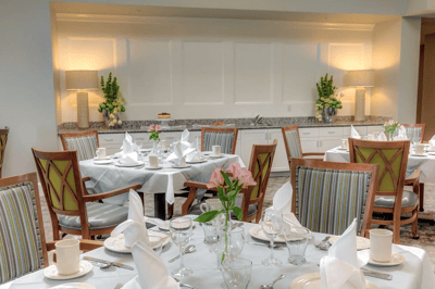 Elegant dining room set for a meal with flowers