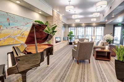Common area with a piano and seating