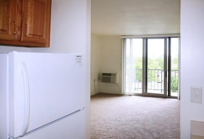 View of an interior apartment space with kitchen
