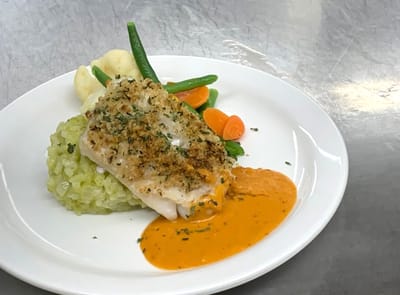 Plated meal featuring fish and vegetables
