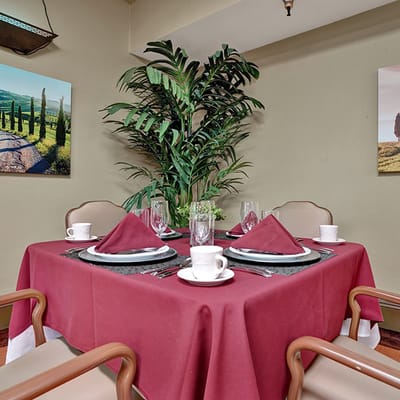 Dining table set for a meal in a facility dining room