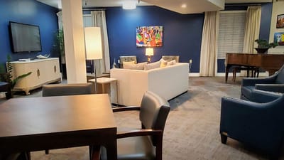 Cozy interior common area with seating and artwork