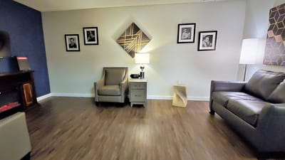Cozy common area with comfortable seating and artwork