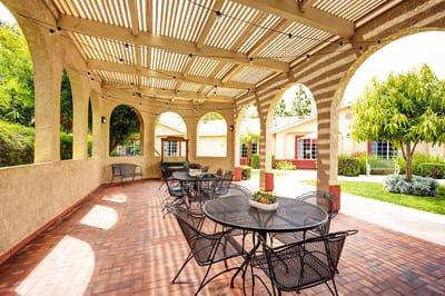 Outdoor patio area with seating and landscaping