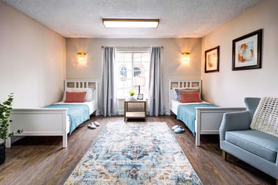 Cozy shared bedroom setup in a senior living facility