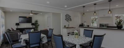Common area with dining setup and lounge space