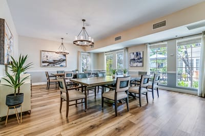 Bright dining room with large windows and modern decor