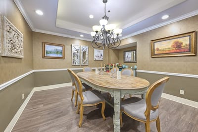 Bright dining room with a large wooden table and chairs