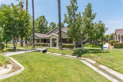 Exterior view of the Cottages at Hemet with landscaping