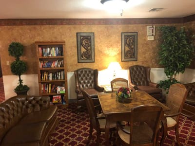 Cozy common area with bookshelves and seating