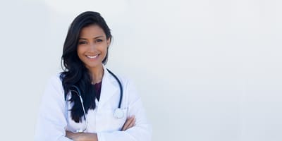 Smiling female doctor in a white coat