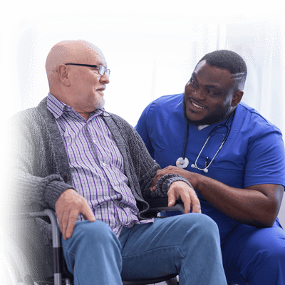 Nurse interacting with a resident in a wheelchair