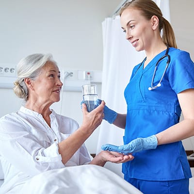 Medical staff assisting a resident in a caring environment