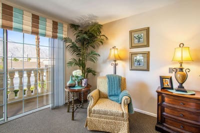 Comfortable seating area in a bright resident room