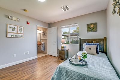 Cozy resident room with a bed and decor