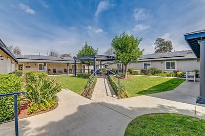 Well-maintained outdoor garden with pathways and seating
