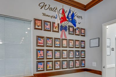 Interior wall honoring veterans with framed photos