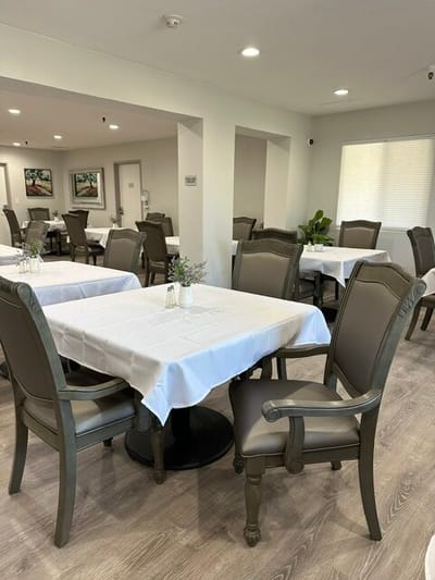 Dining area with tables set for residents