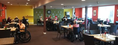 Dining area with residents enjoying a meal together