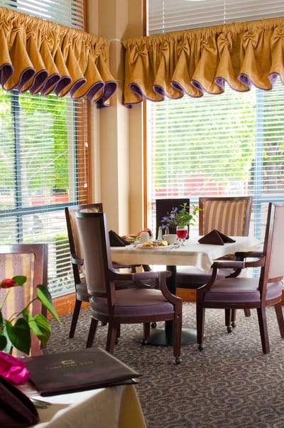Elegant dining room setup with table and chairs