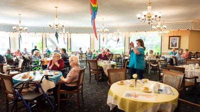 Residents enjoying a meal in a dining room