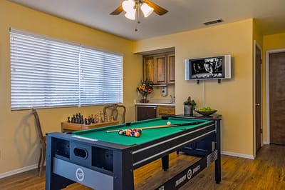 A common area with a billiards table and chess set